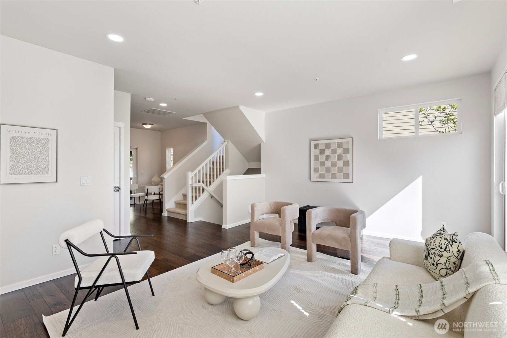 83 Sky Ridge Road Northwest Issaquah, WA 98027 - Photo 6 of 28 a living room with furniture and white walls