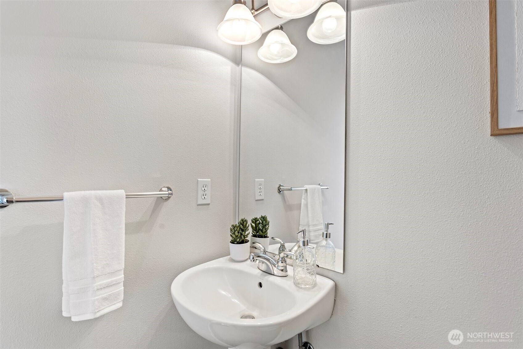 83 Sky Ridge Road Northwest Issaquah, WA 98027 - Photo 8 of 28 a bathroom with a sink and a mirror