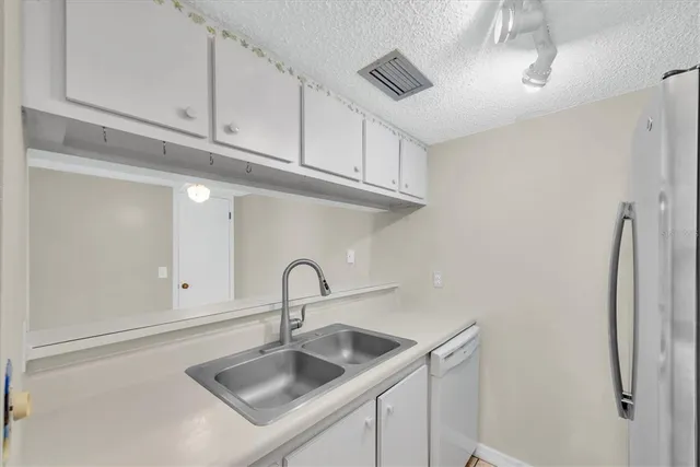 a room with a bench and a wooden floor