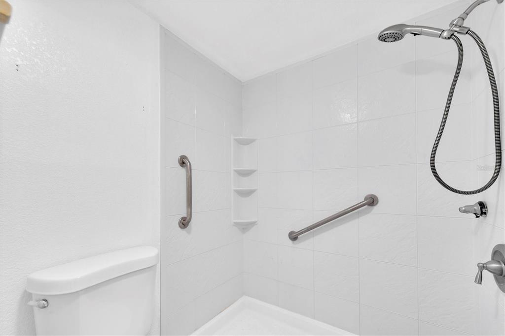 171 Medallion Boulevard, Unit F Madeira Beach, FL 33708 - Photo 16 of 30 a bathroom with a shower