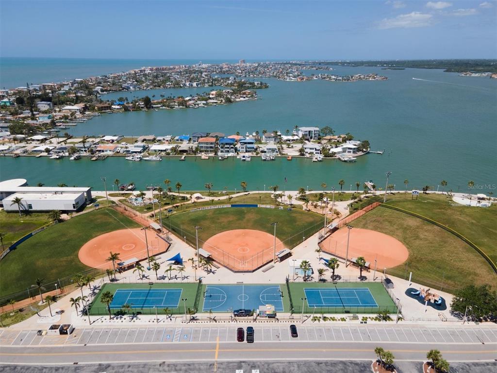 171 Medallion Boulevard, Unit F Madeira Beach, FL 33708 - Photo 27 of 30 an aerial view of a city