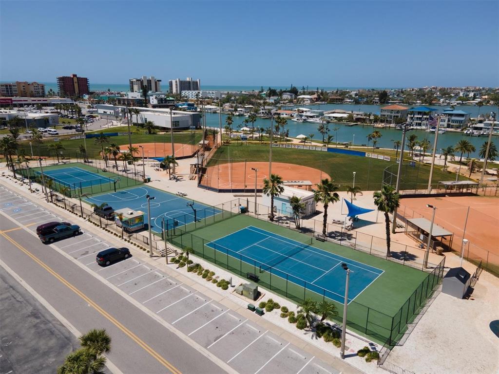 171 Medallion Boulevard, Unit F Madeira Beach, FL 33708 - Photo 28 of 30 an aerial view of a tennis court