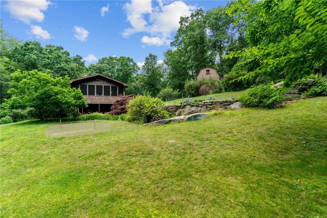 252 Log Bridge Road Coventry, RI 02816 - Photo 31 of 36 Side view of the house (enclosed porch side)