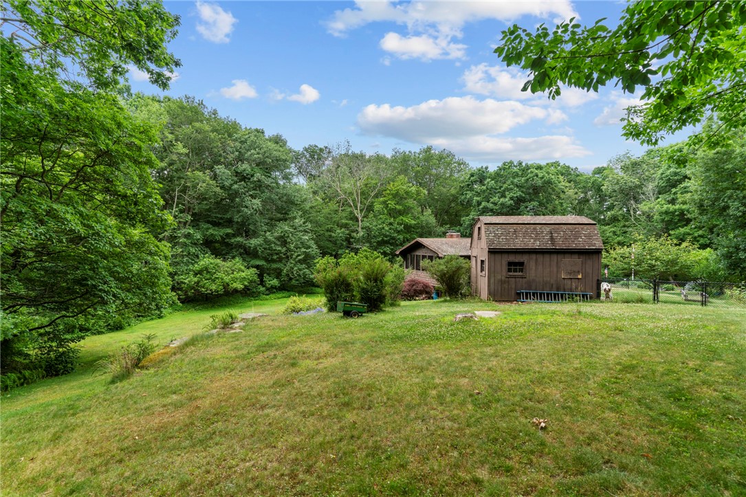 252 Log Bridge Road Coventry, RI 02816 - Photo 32 of 36 Backyard view looking towards the large shed and the house