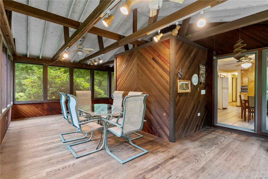 252 Log Bridge Road Coventry, RI 02816 - Photo 6 of 36 Come around the back and enter into this awesome enclosed porch that offers tons of extra space - and great potential to truly enclose for extra living space on the main floor