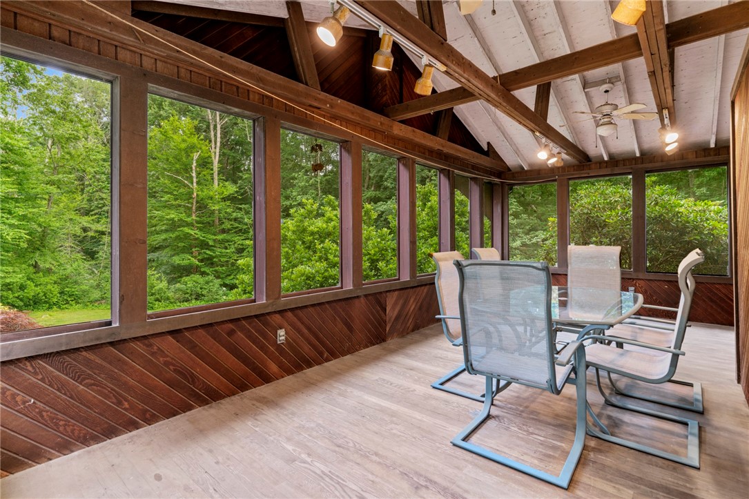 252 Log Bridge Road Coventry, RI 02816 - Photo 7 of 36 Sit out and enjoy a beautiful summer night or coffee in the morning! This enclosed porch offers tons of extra space and could easily be finished for extra living space!