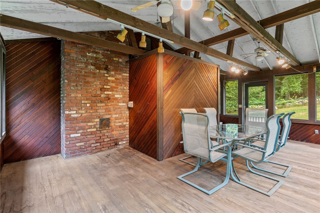 252 Log Bridge Road Coventry, RI 02816 - Photo 8 of 36 Sit out and enjoy a beautiful summer night or coffee in the morning! This enclosed porch offers tons of extra space and could easily be finished for extra living space!