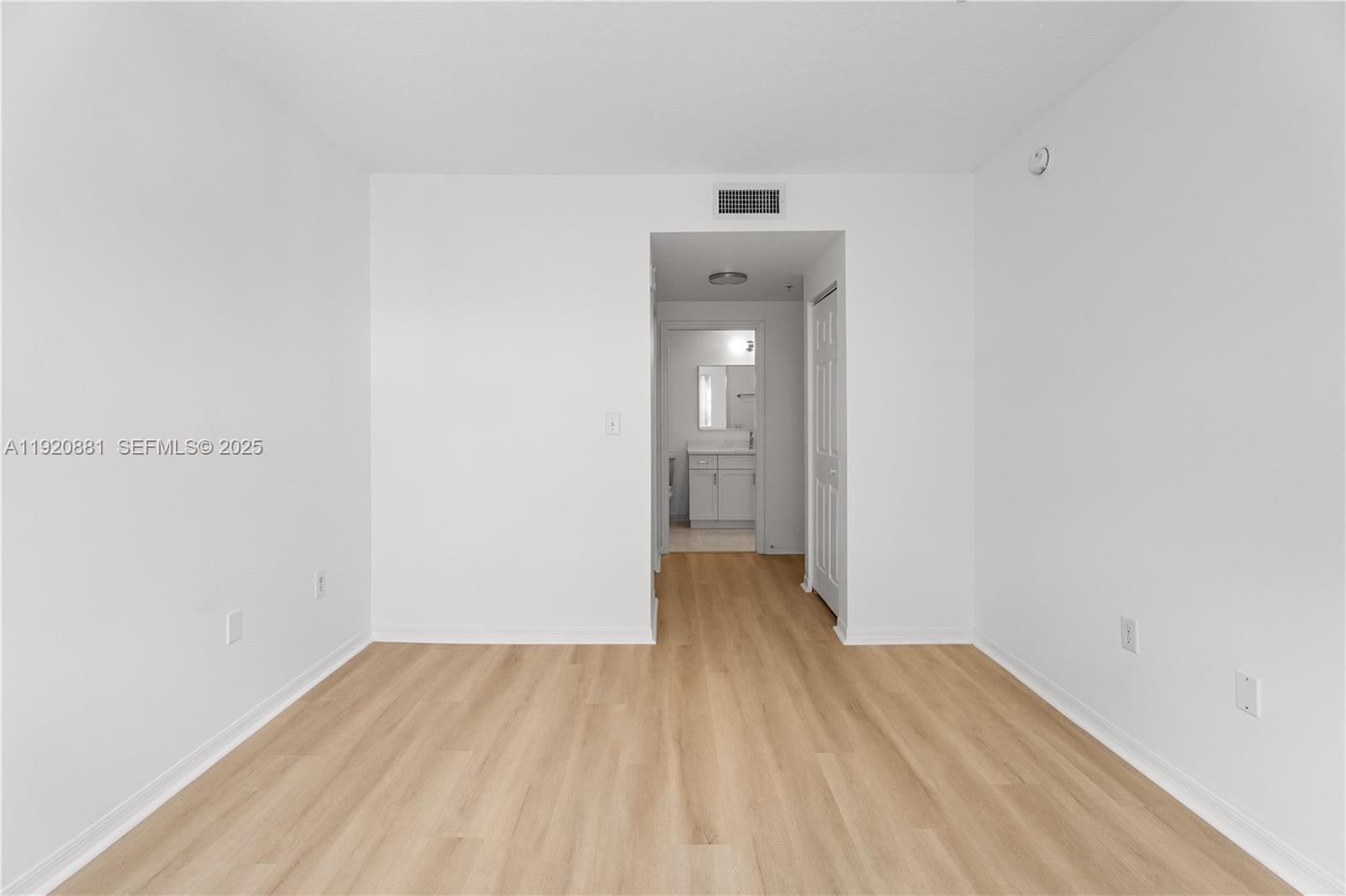 6821 Southwest 44th Street, Unit 203 Miami, FL 33155 - Photo 11 of 28 a view of a room with wooden floor