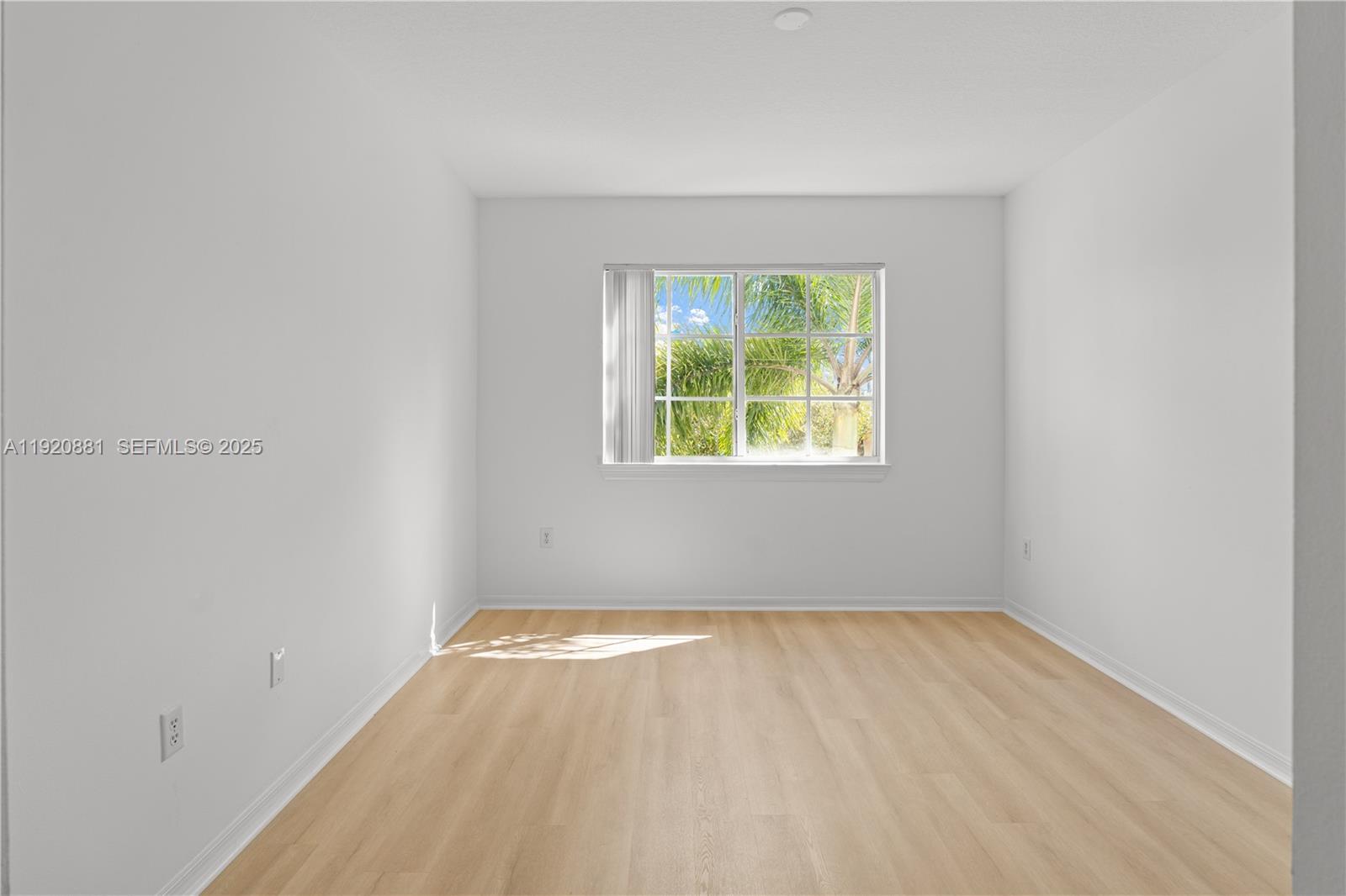 6821 Southwest 44th Street, Unit 203 Miami, FL 33155 - Photo 12 of 28 an empty room with a window