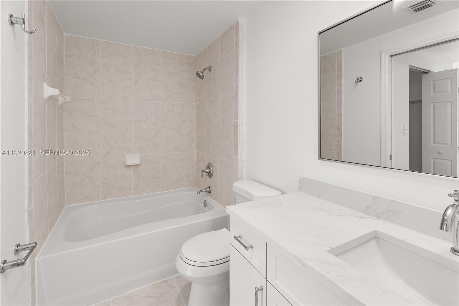 6821 Southwest 44th Street, Unit 203 Miami, FL 33155 - Photo 13 of 28 a bathroom with a sink a toilet and a bathtub