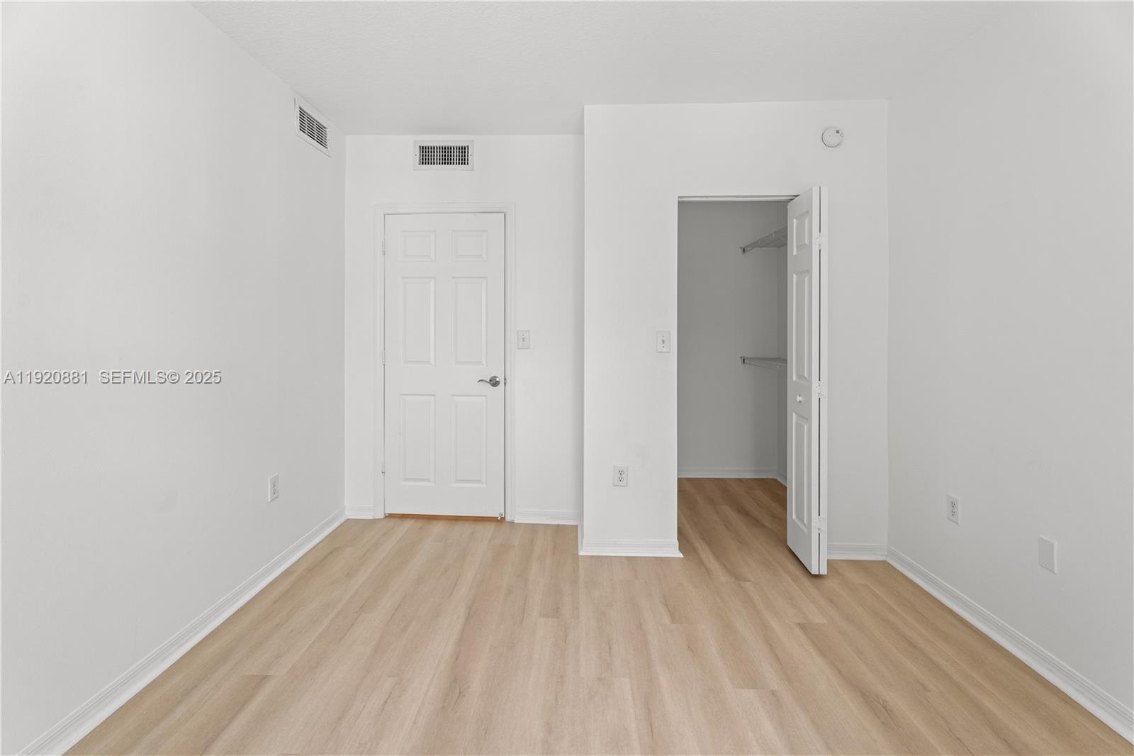 6821 Southwest 44th Street, Unit 203 Miami, FL 33155 - Photo 16 of 28 a view of a room with wooden floor