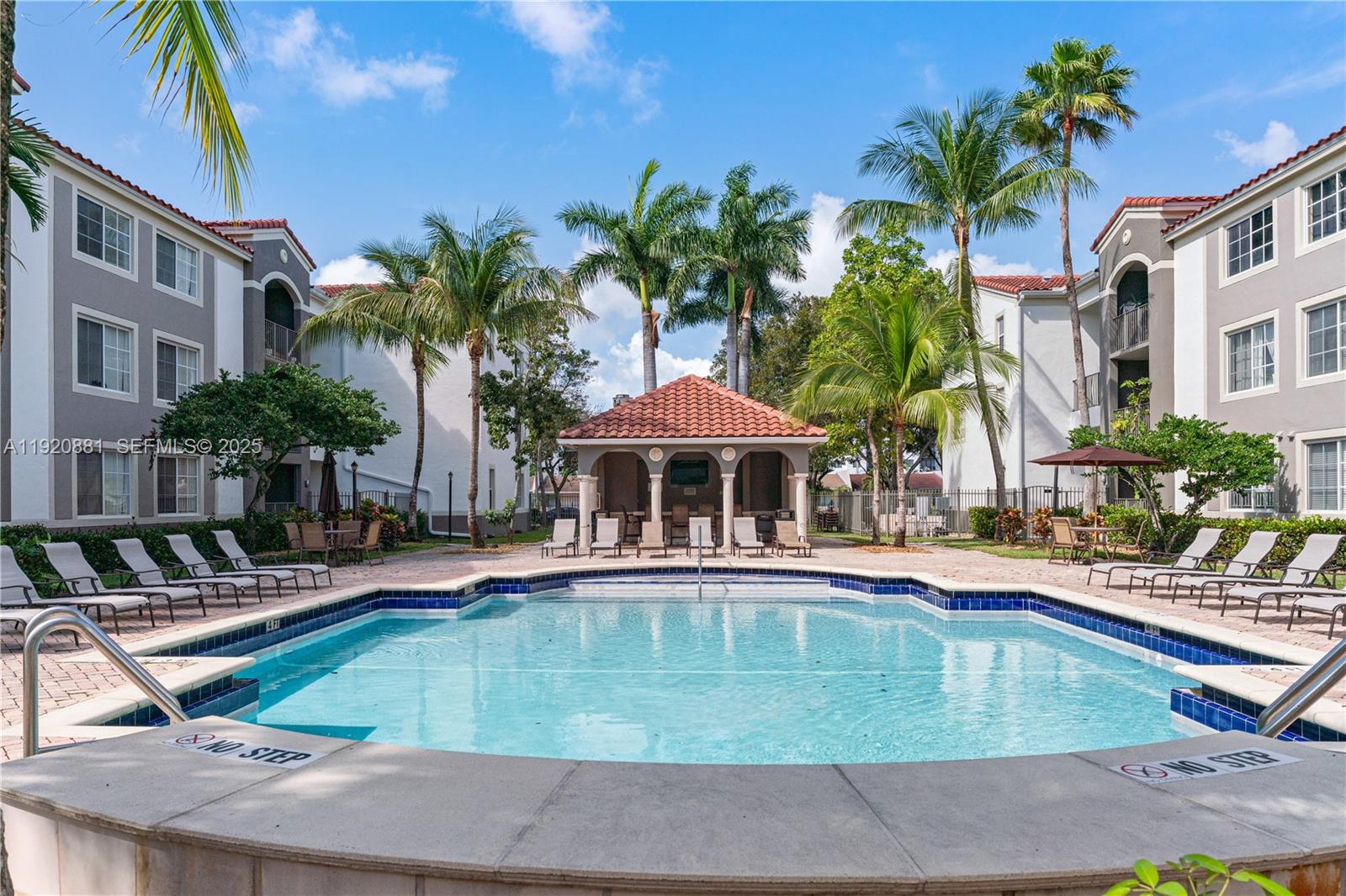 6821 Southwest 44th Street, Unit 203 Miami, FL 33155 - Photo 18 of 28 a view of a house with swimming pool
