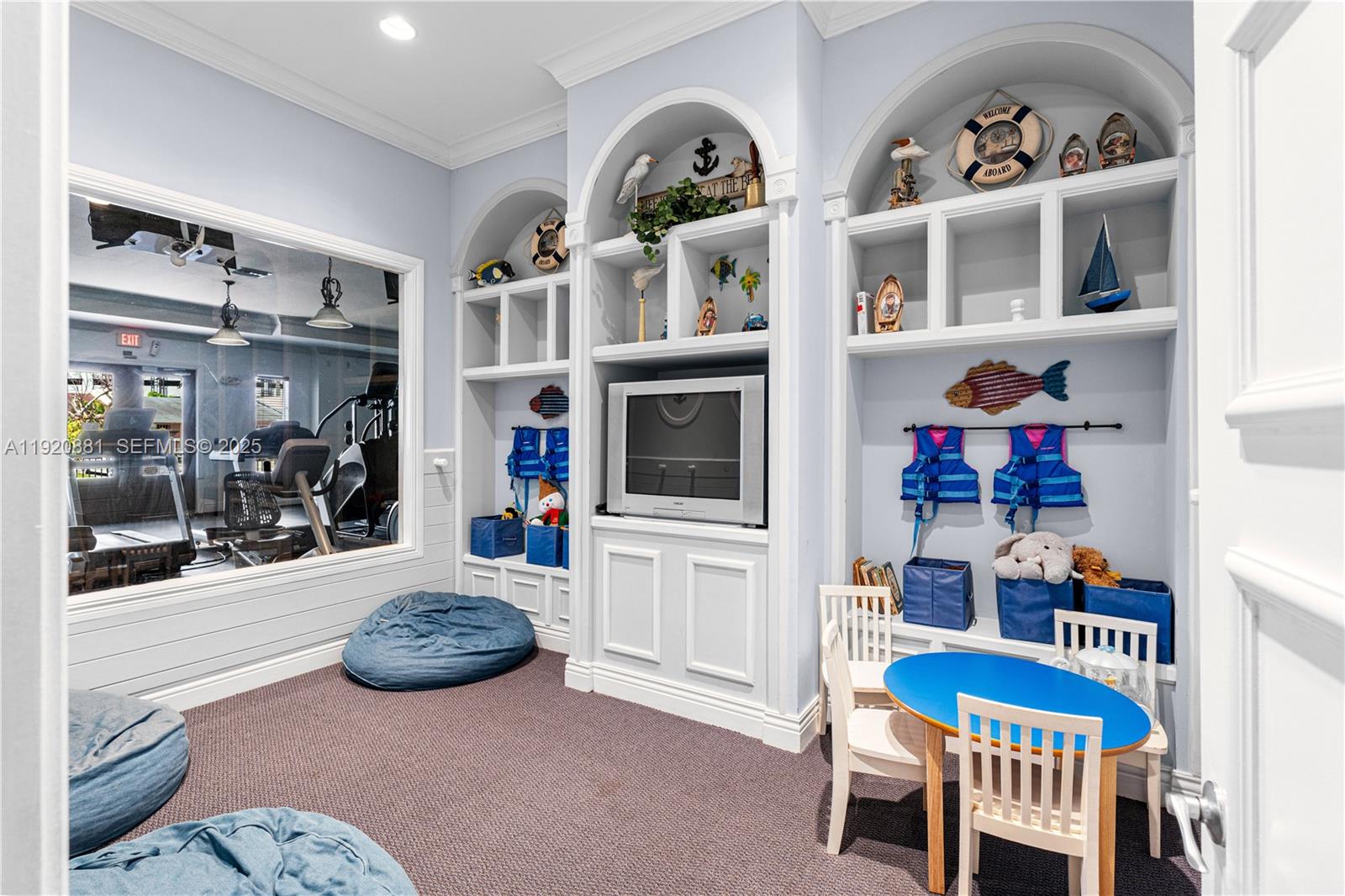 6821 Southwest 44th Street, Unit 203 Miami, FL 33155 - Photo 27 of 28 a view of a livingroom with furniture and fan