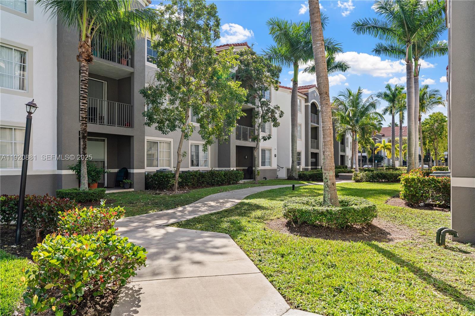 6821 Southwest 44th Street, Unit 203 Miami, FL 33155 - Photo 28 of 28 a view of a fountain in front of a brick house