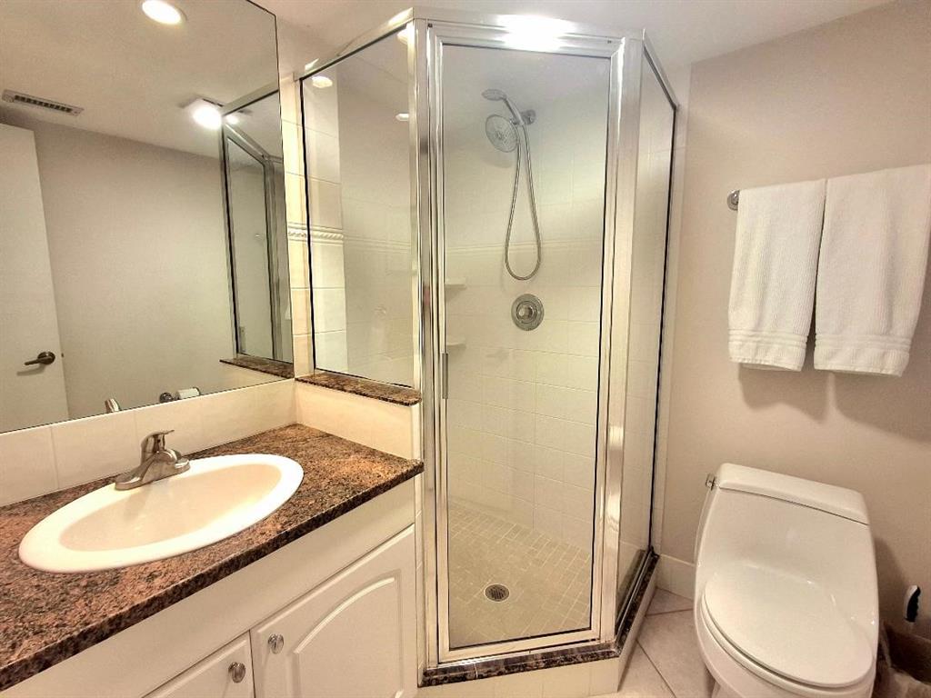 1421 South Ocean Boulevard, Unit 318 Pompano Beach, FL 33062 - Photo 17 of 36 a bathroom with a sink toilet and shower