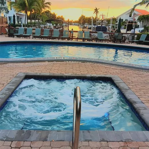 a view of a lake with furniture