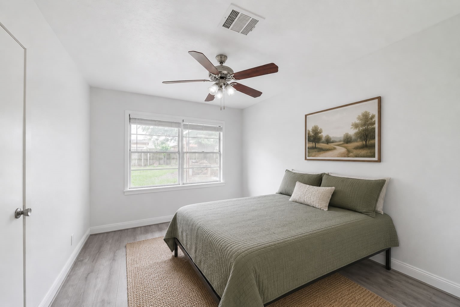 415 Gober Street Houston, TX 77017 - Photo 7 of 12 a bedroom with a large bed and a window