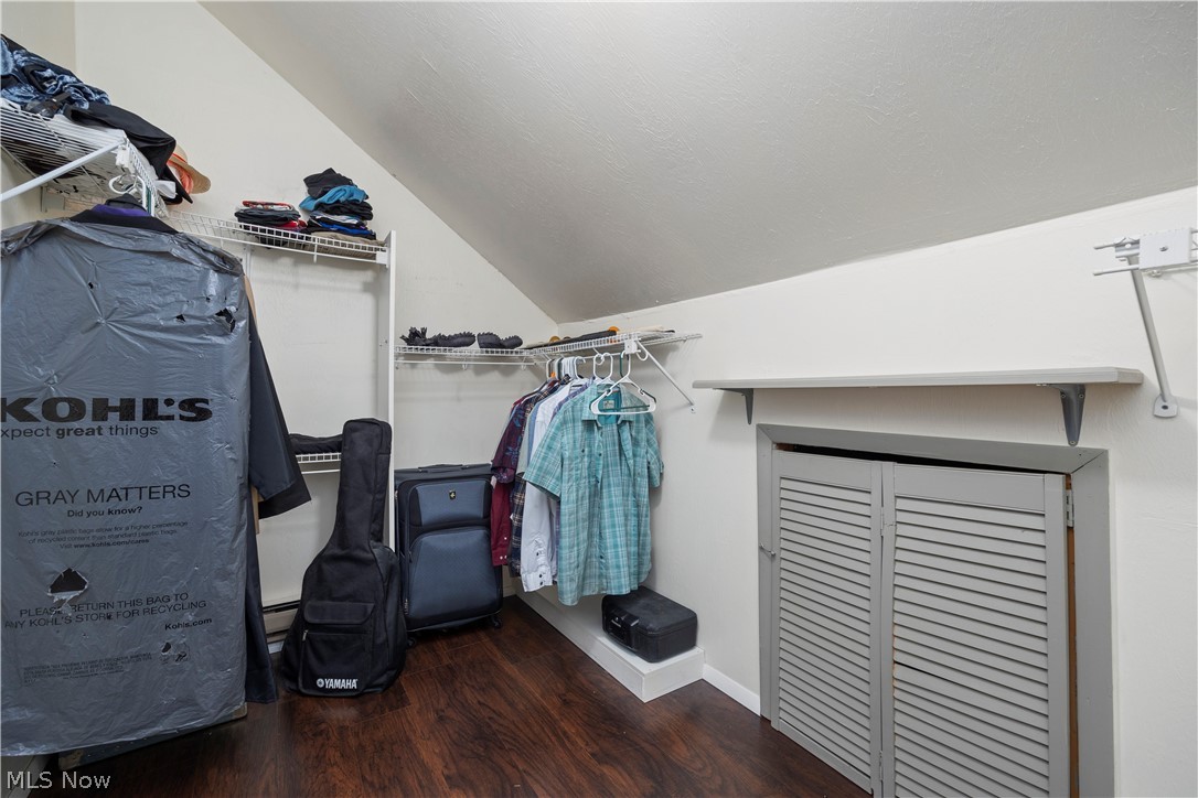 2565 Abbe Road North Sheffield Lake, OH 44054 - Photo 23 of 32 Spacious closet featuring wood finished floors and vaulted ceiling