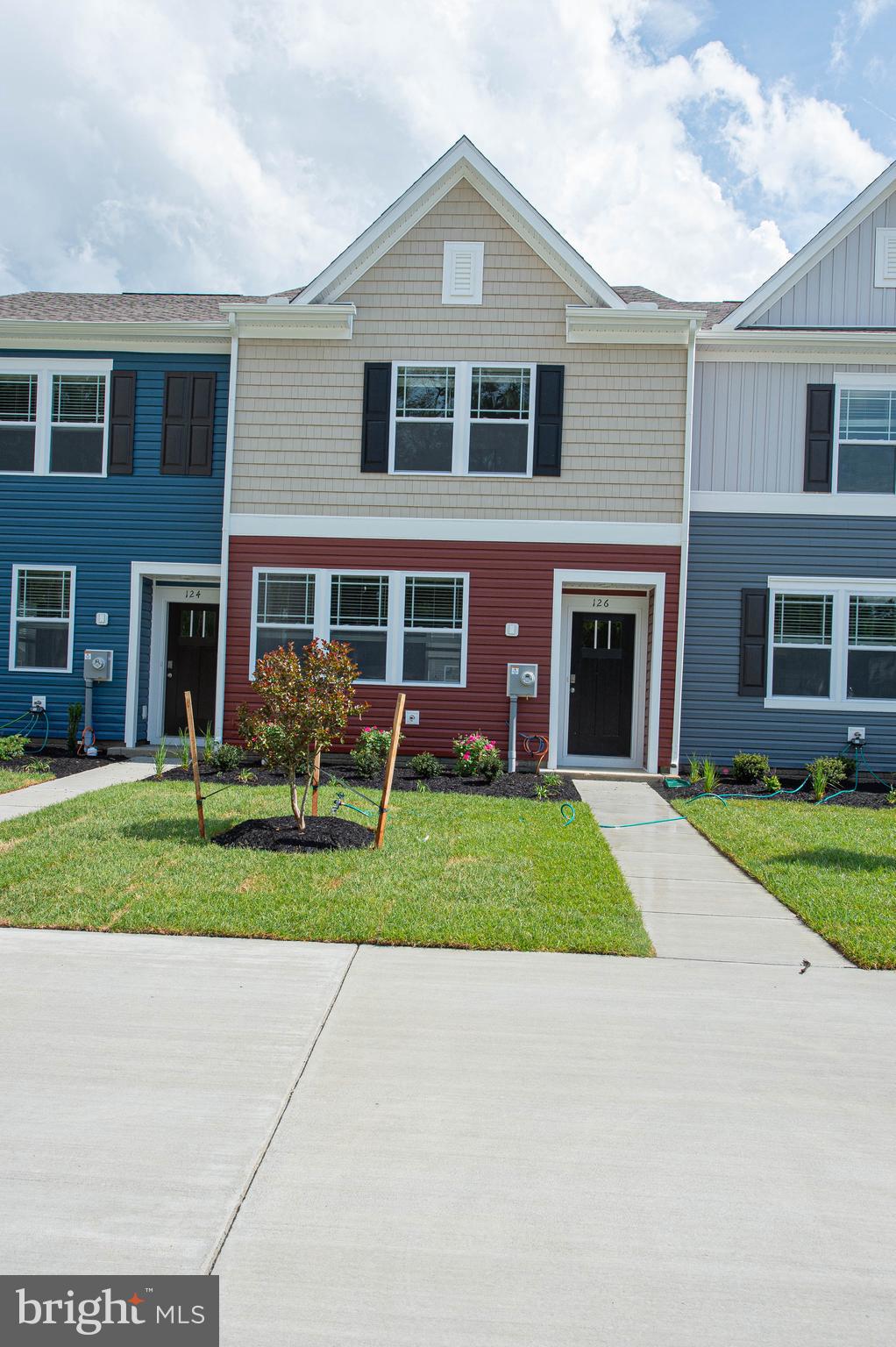 126 Willowtree Lane Fruitland, MD 21826 - Photo 1 of 68 a front view of a house with a yard and garage
