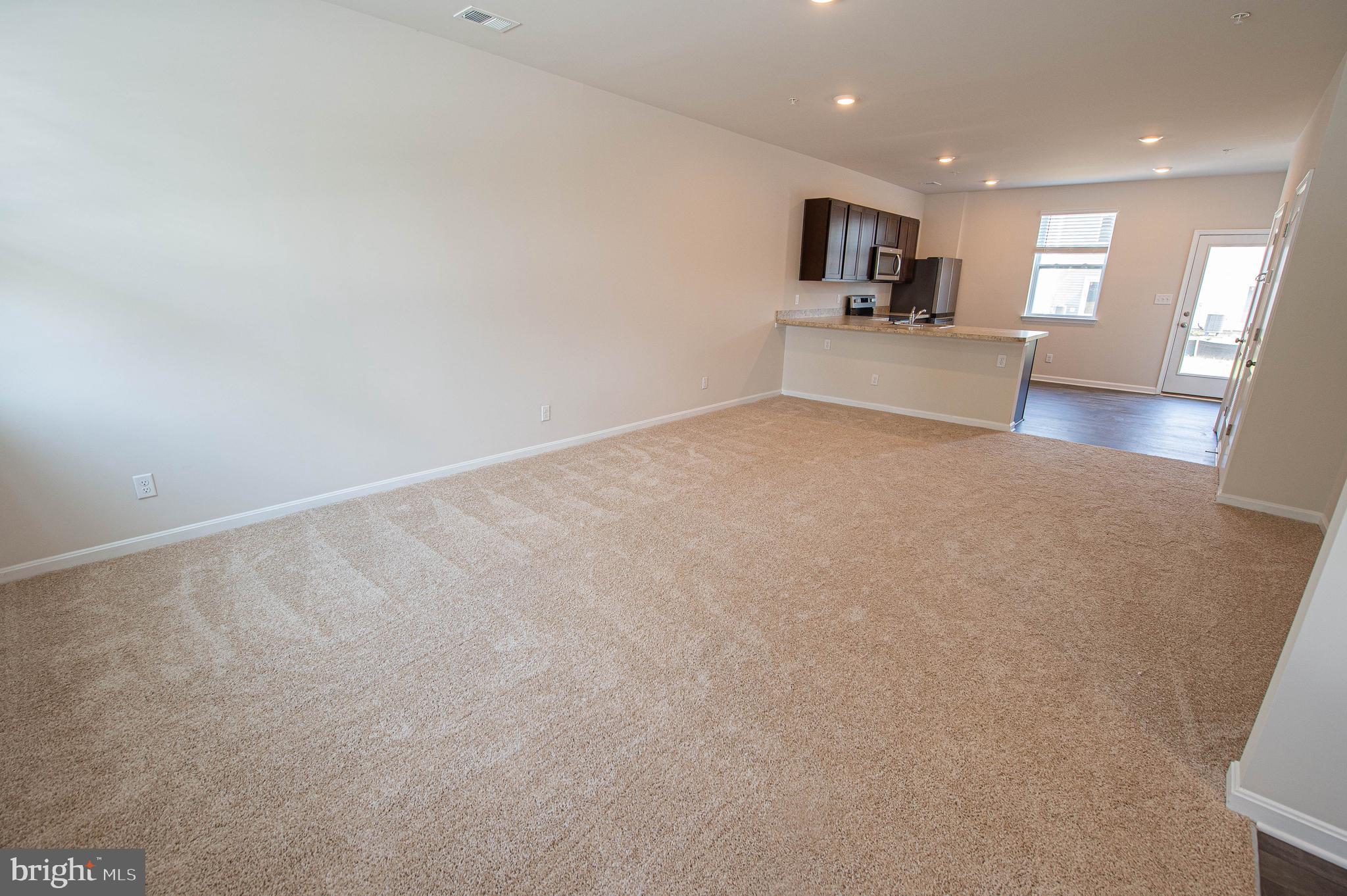 126 Willowtree Lane Fruitland, MD 21826 - Photo 14 of 68 a view of a kitchen with a sink and a refrigerator