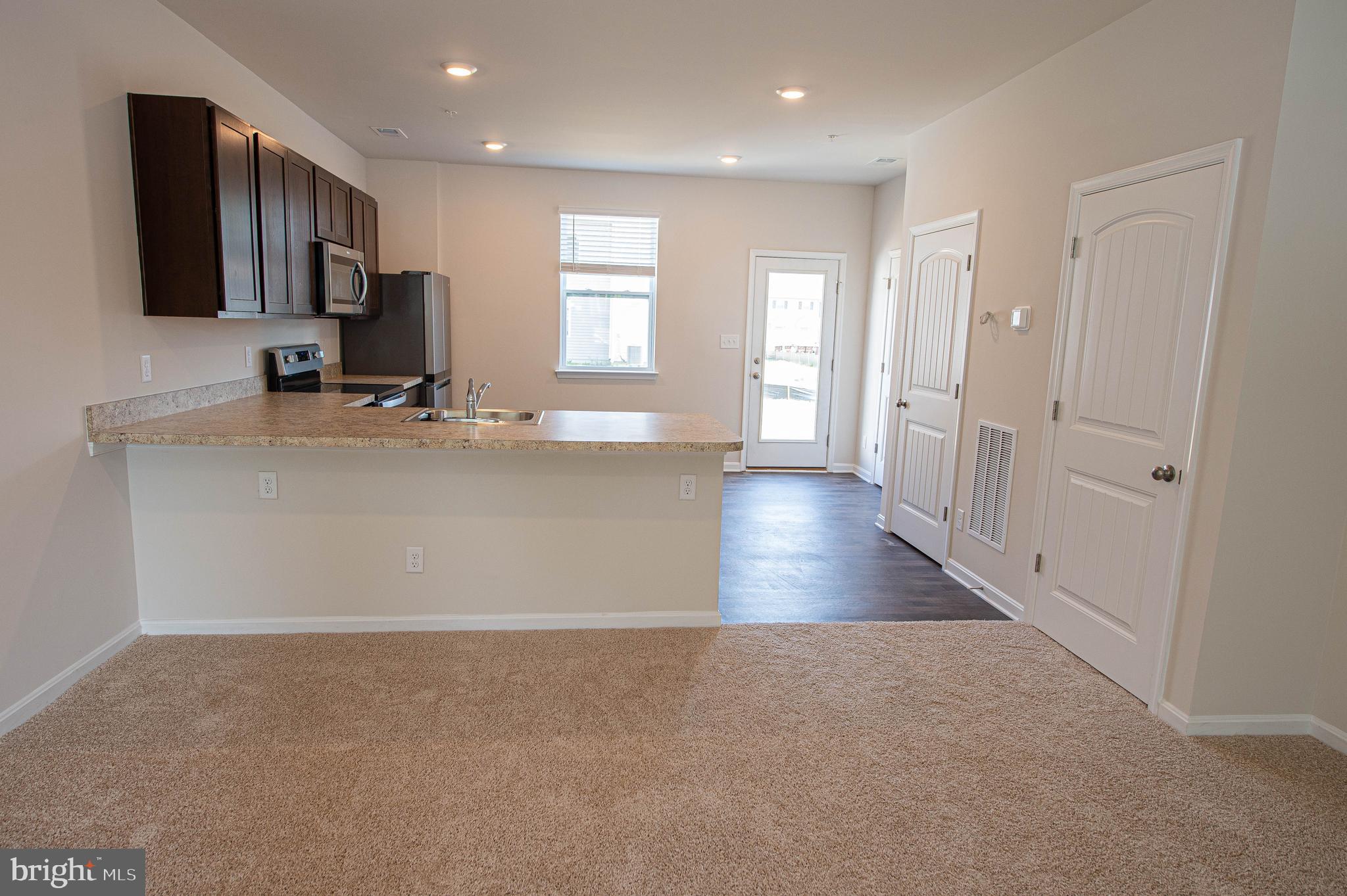 126 Willowtree Lane Fruitland, MD 21826 - Photo 20 of 68 a view of a kitchen cabinets and a wooden floor