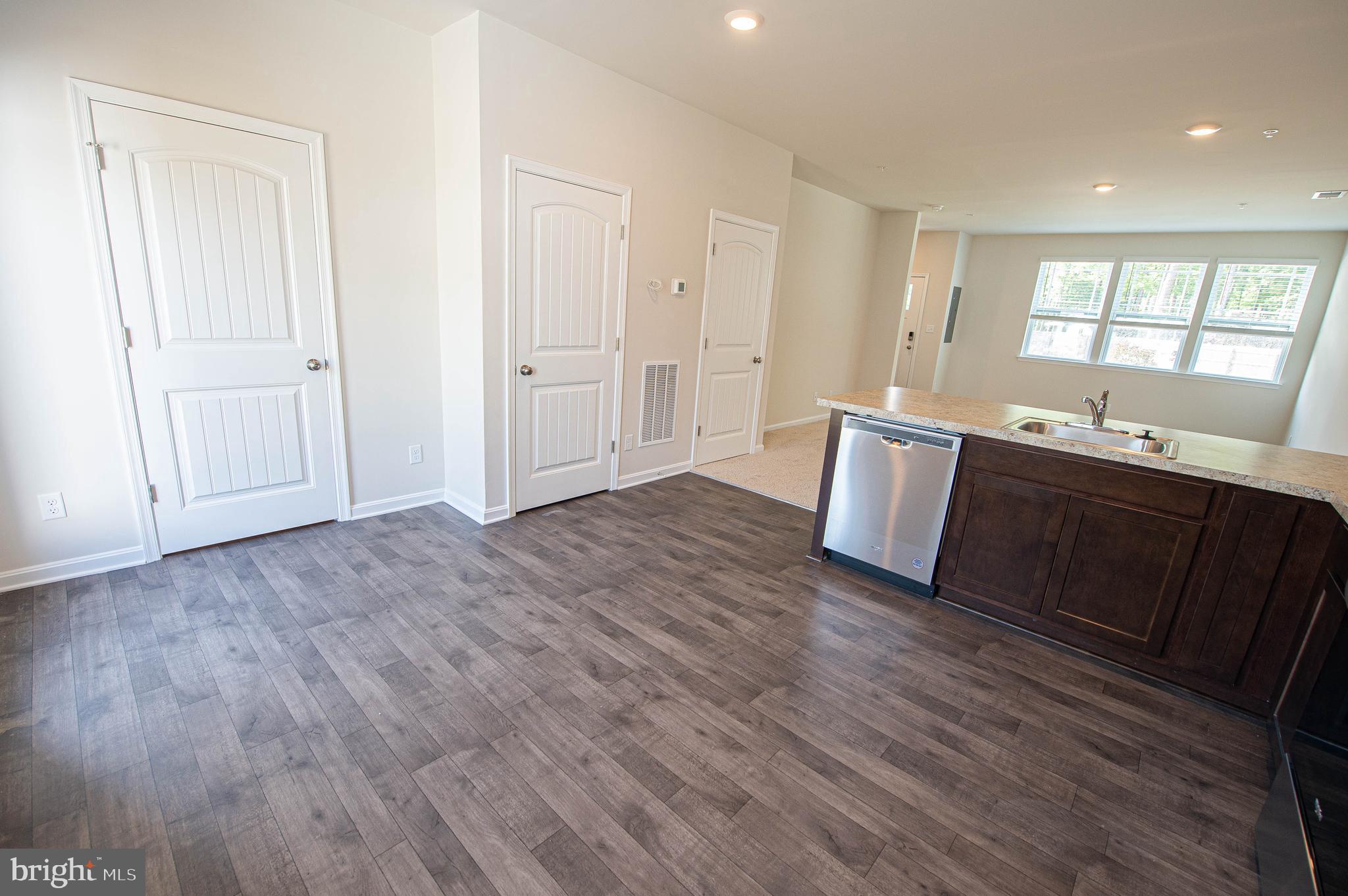 126 Willowtree Lane Fruitland, MD 21826 - Photo 27 of 68 a view of kitchen with wooden floor and sink