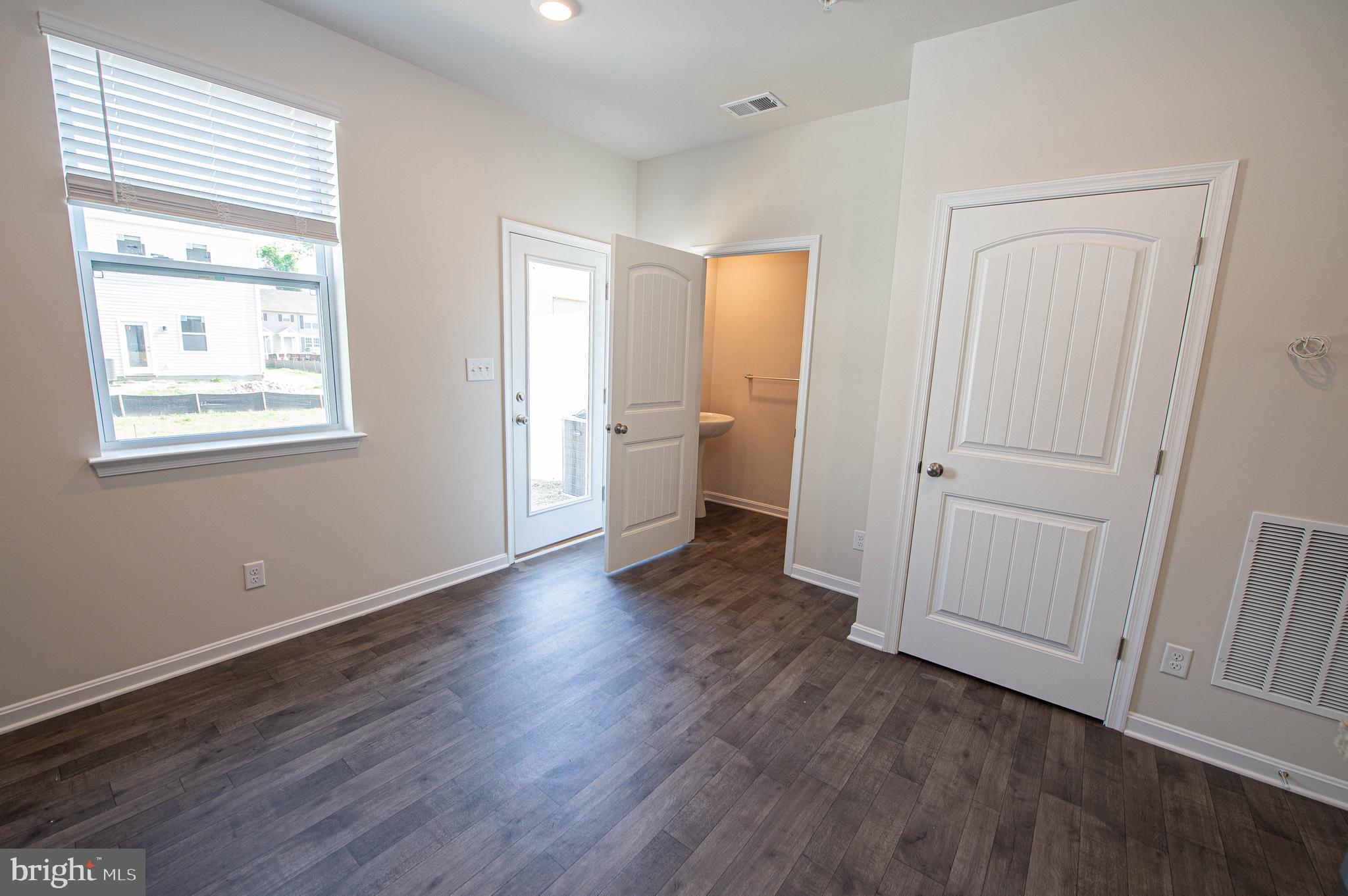 126 Willowtree Lane Fruitland, MD 21826 - Photo 28 of 68 a view of a room with wooden floor and a window