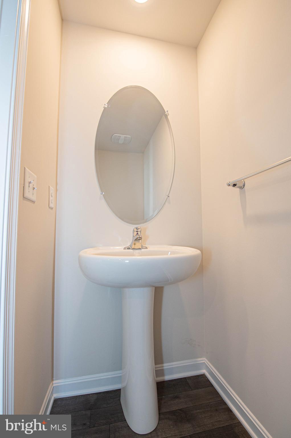 126 Willowtree Lane Fruitland, MD 21826 - Photo 30 of 68 a bathroom with a sink and mirror
