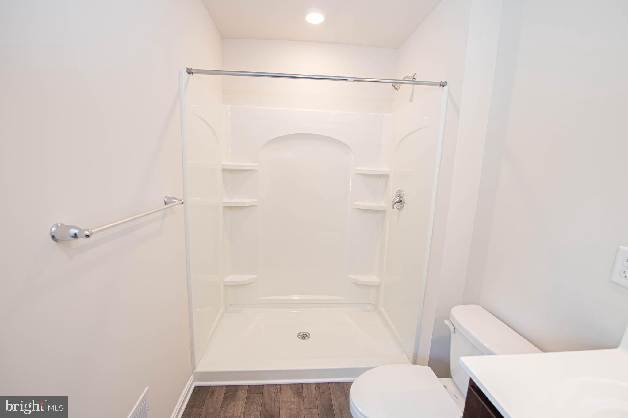 126 Willowtree Lane Fruitland, MD 21826 - Photo 54 of 68 a bathroom with a shower and toilet