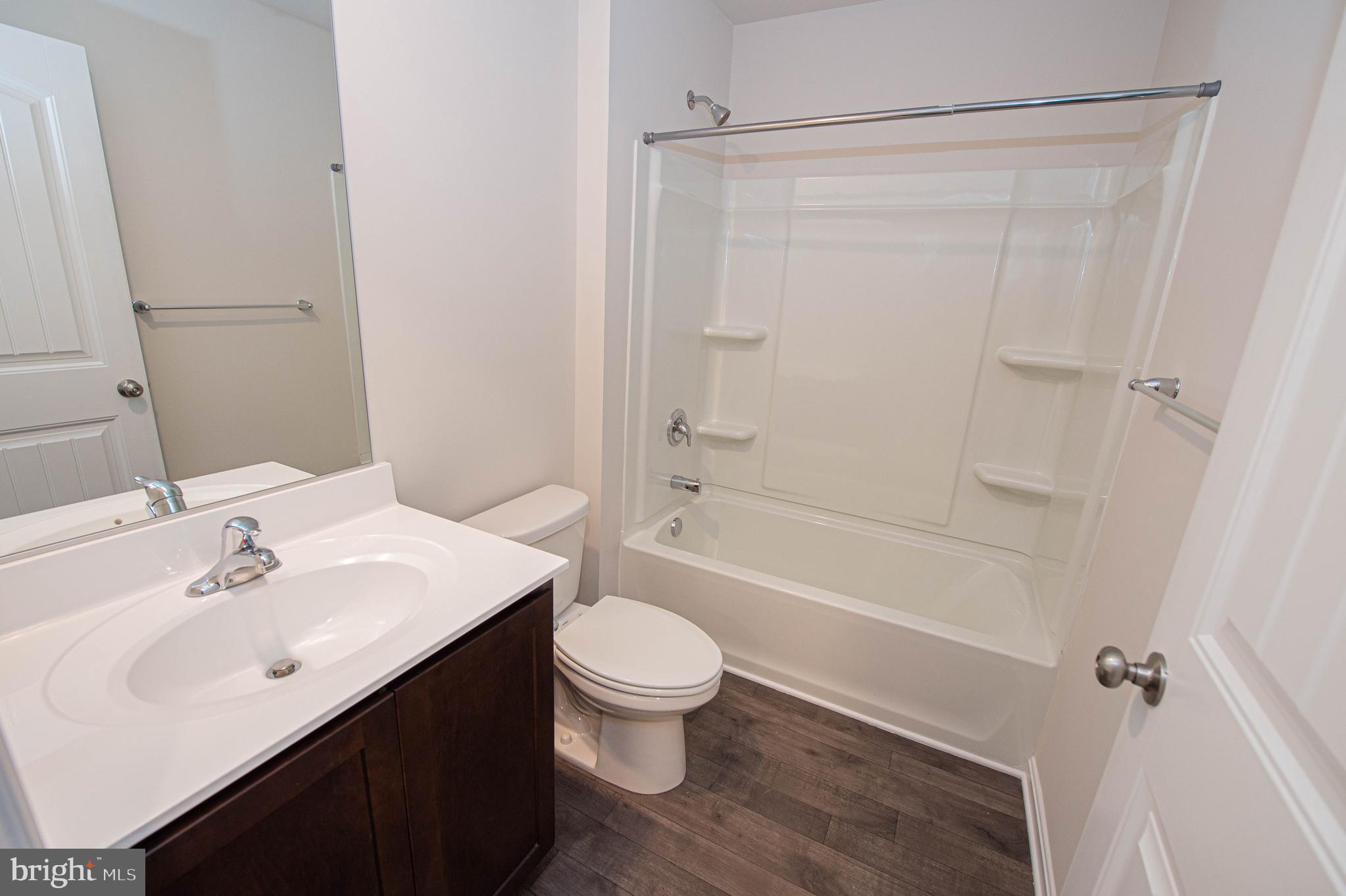 126 Willowtree Lane Fruitland, MD 21826 - Photo 66 of 68 a bathroom with a sink a toilet and shower