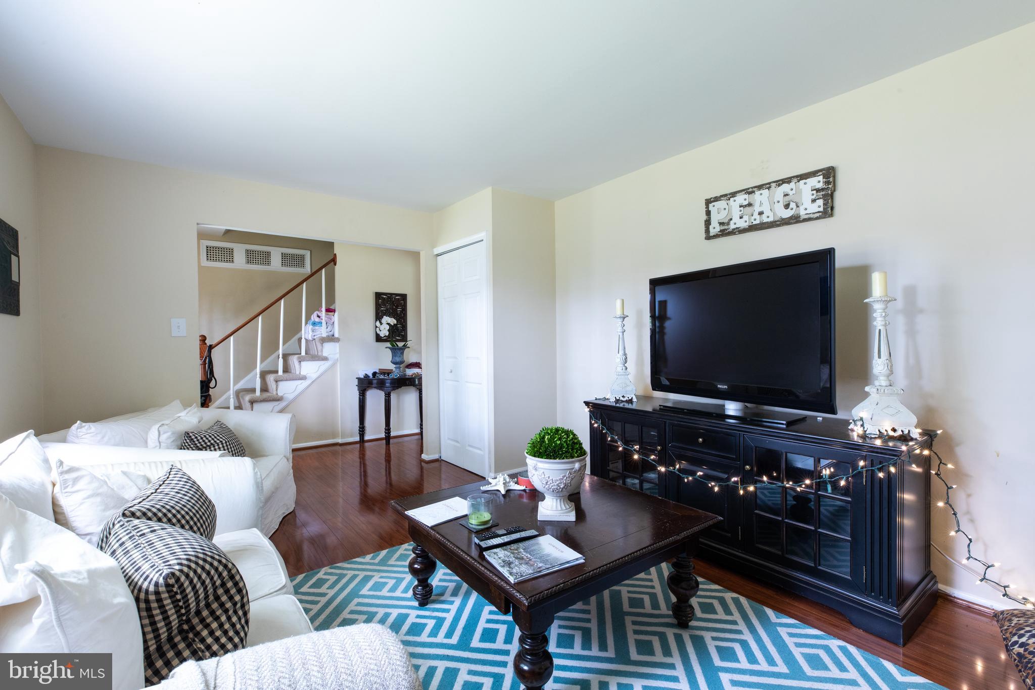 2527 Lindley Terrace Rockville, MD 20850 - Photo 1 of 31 a living room with furniture and a flat screen tv