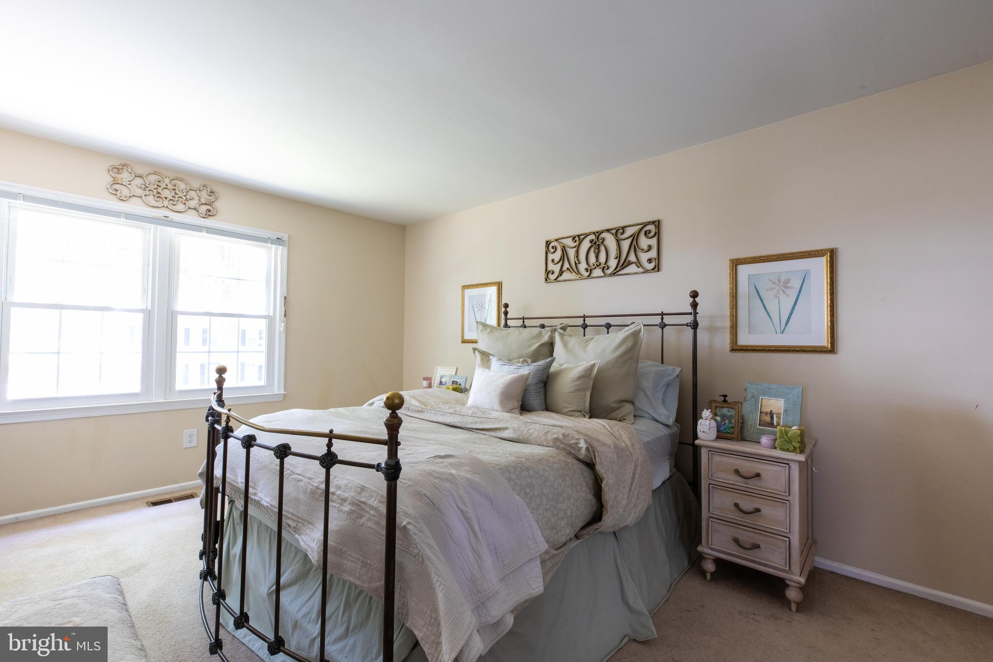 2527 Lindley Terrace Rockville, MD 20850 - Photo 15 of 31 a bedroom with a bed and a window