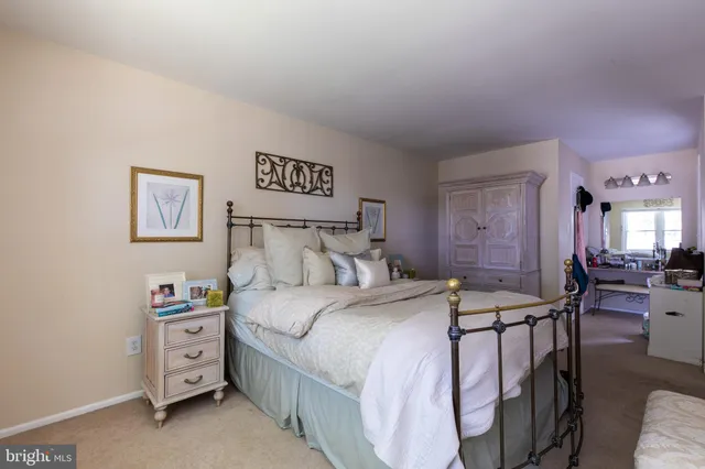 a bedroom with a bed and a furniture