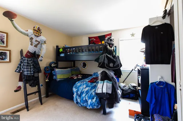 a bedroom with a bed and a closet