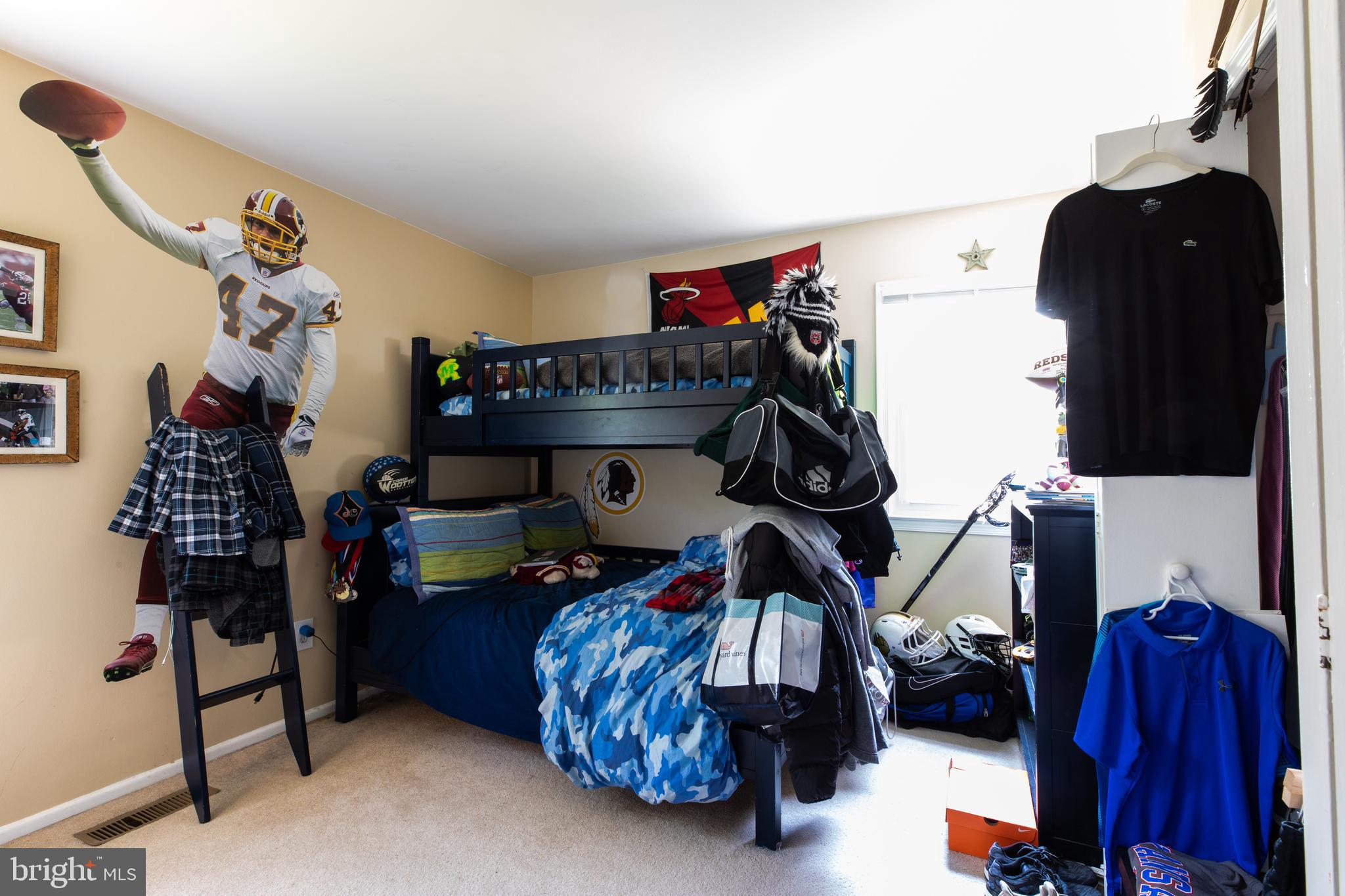 2527 Lindley Terrace Rockville, MD 20850 - Photo 19 of 31 a bedroom with a bed and a closet