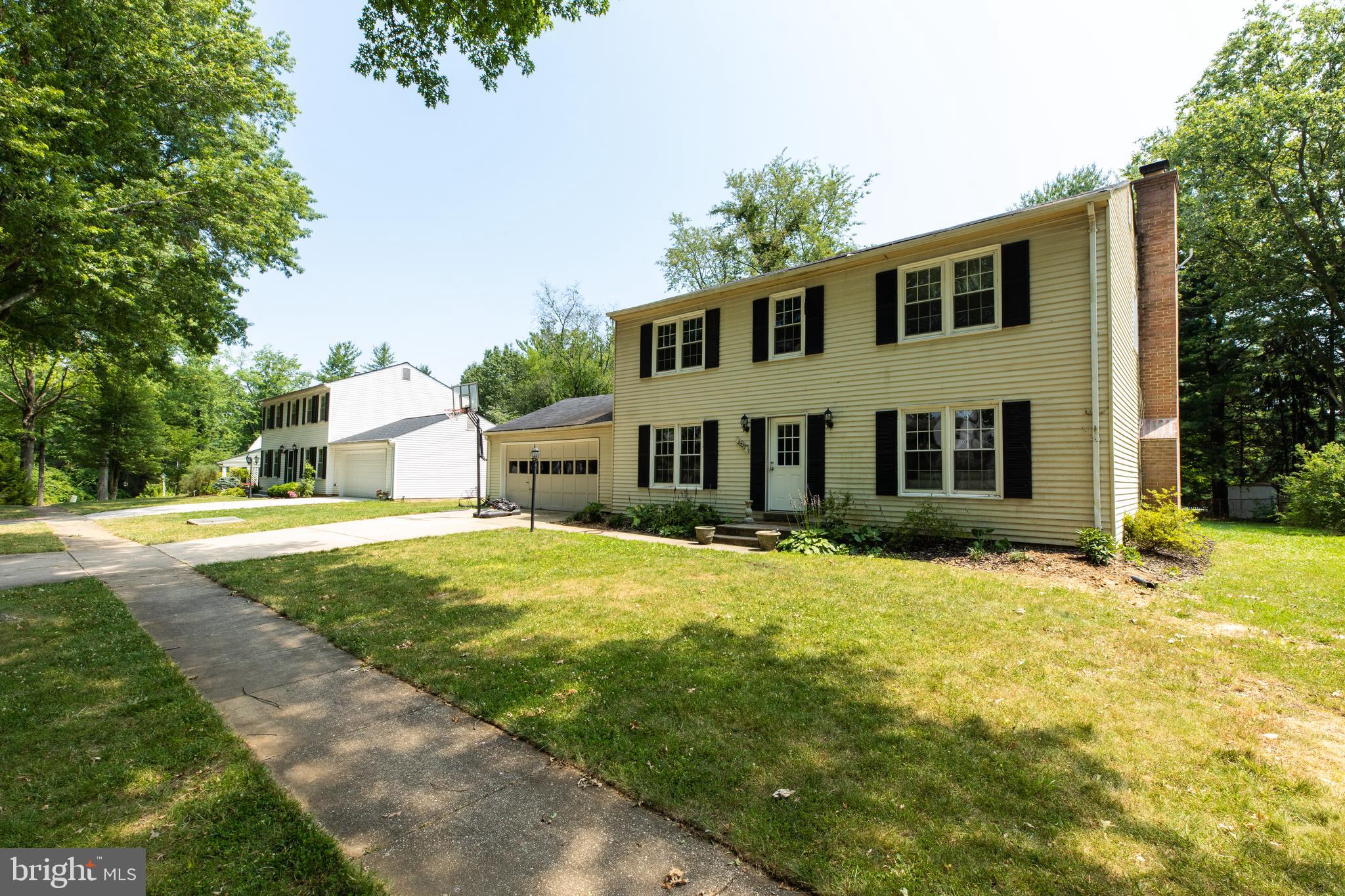 2527 Lindley Terrace Rockville, MD 20850 - Photo 2 of 31 a front view of a house with a yard