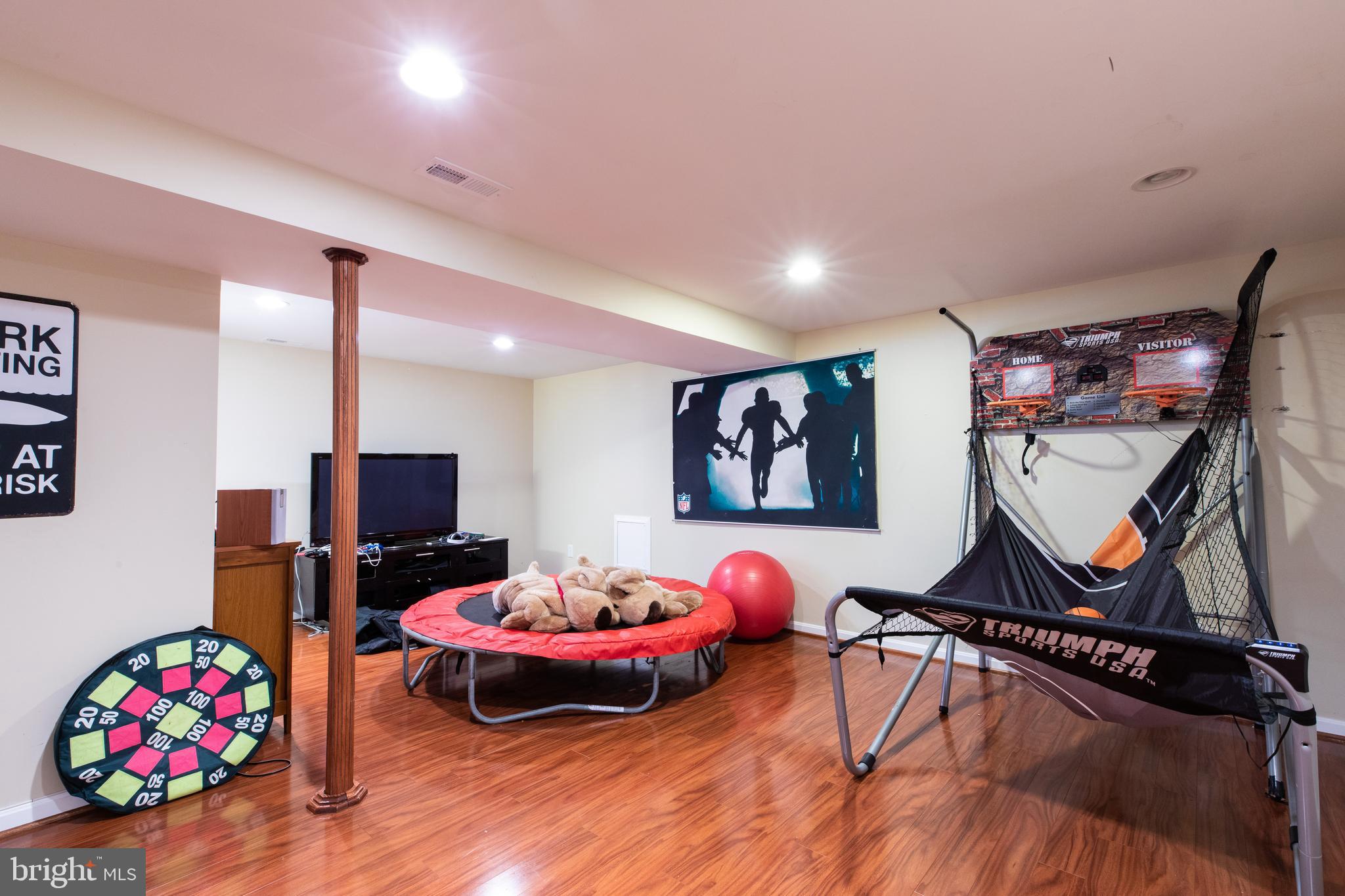 2527 Lindley Terrace Rockville, MD 20850 - Photo 21 of 31 a room with furniture and wooden floor