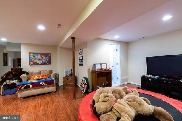 a bedroom with furniture and a flat screen tv