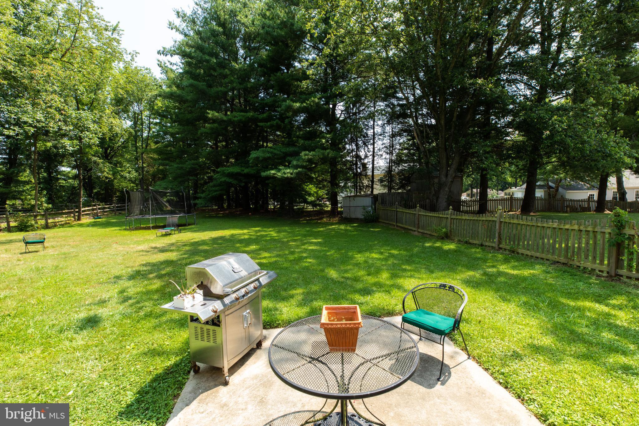 2527 Lindley Terrace Rockville, MD 20850 - Photo 27 of 31 a backyard of a house with table and chairs