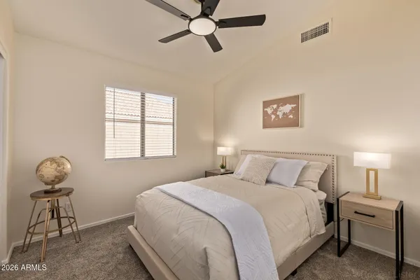 a bedroom with a bed and window