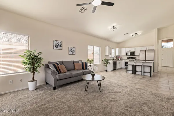 a living room with furniture and a large window