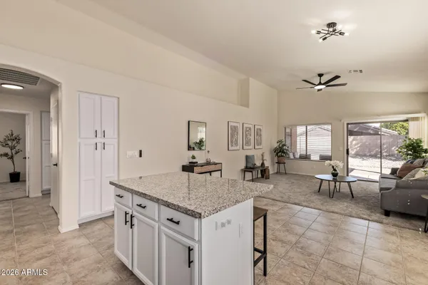a view of living room with granite countertop furniture and fireplace