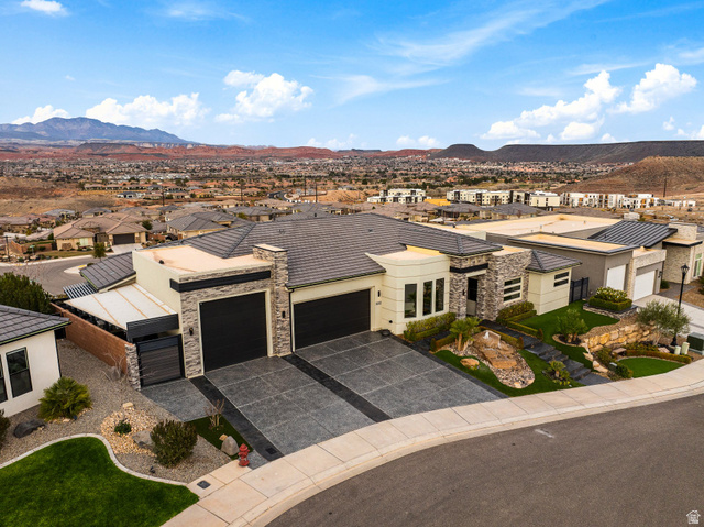 3022 West Sesia Way St. George, UT 84770 - Photo 13 of 52 View of front of house with a garage, a residential view, a mountain view, and driveway