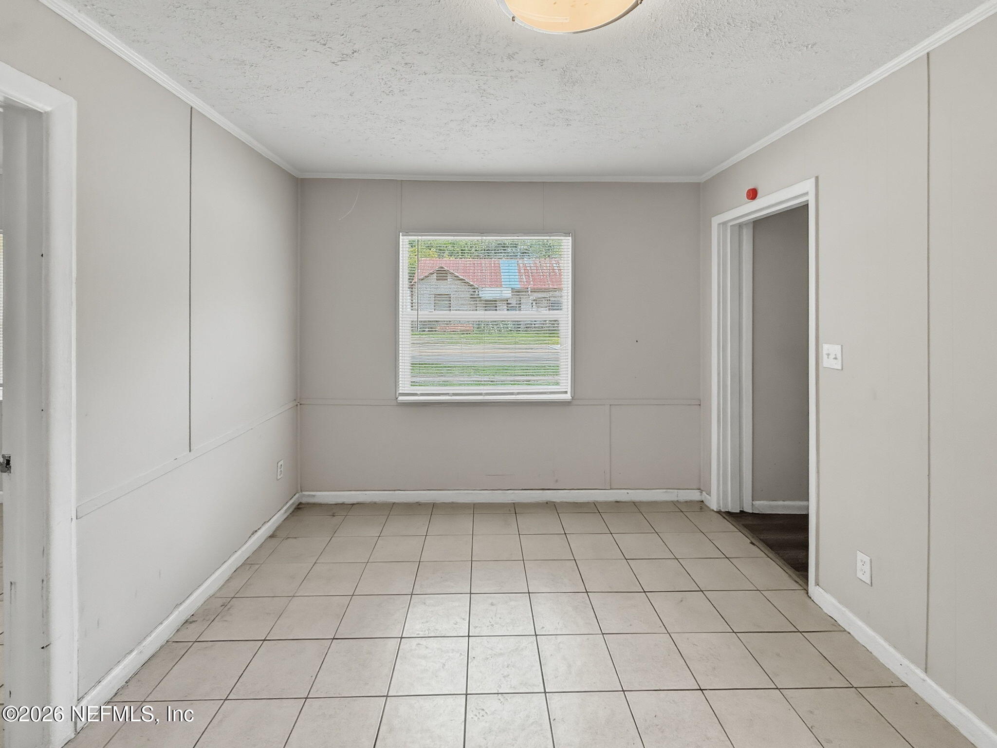 326 Cahoon Road South Jacksonville, FL 32220 - Photo 14 of 34 a view of an empty room with a window