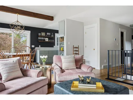 a view of a livingroom with furniture and window