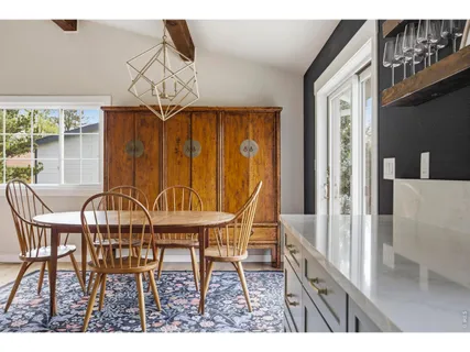 a dining room with furniture and window