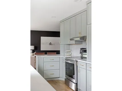 a kitchen with a sink cabinets and stainless steel appliances