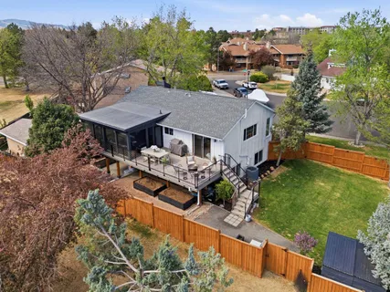 an aerial view of a house with garden space and street view