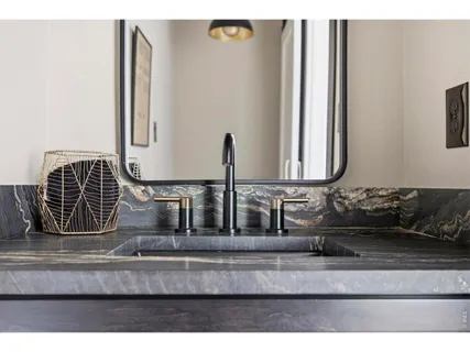 a living room with lots of furniture and a book shelf