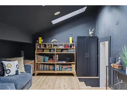 a living room with a bed